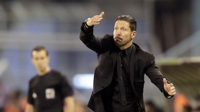 Atletico Madrid's coach Diego Pablo Simeone gestures during their Spanish first division soccer match against Celta Vigo at the Balaidos stadium in Vigo March 8, 2014. REUTERS/Miguel Vidal