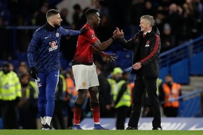 Manchester United caretaker manager Ole Gunnar Solskjaer, right, is impressed with Paul Pogba. Matt Dunham / AP Photo