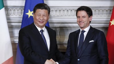 Italian prime minister Giuseppe Conte shakes hands with the Chinese president Xi Jinping during a recent meeting in Rome. EPA