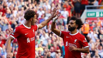 Liverpool's Mohamed Salah celebrates with Curtis Jones after scoring. Reuters