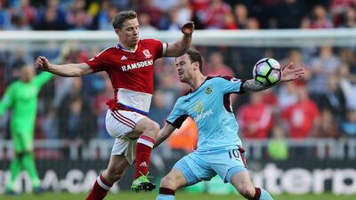 Adam Clayton of Middlesbrough, left, and Ashley Barnes of Burnley, right, battle for possession during the Premier League match between Middlesbrough and Burnley at Riverside Stadium on April 8, 2017 in Middlesbrough, England. Nigel Roddis / Getty Images
