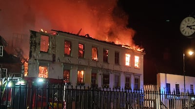 Firefighters dealing with a fire in Midhurst, West Sussex which includes a 400-year-old hotel that was said to be housing Ukrainian refugees. The fire was thought to have broken out shortly after 1am on Thursday at a property on North Street before spreading to the roof of the Angel Inn next door. Issue date: Thursday March 16, 2023.
