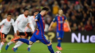 Barcelona’s Argentine forward Lionel Messi scores a penalty. Lluis Gene / AFP