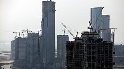 Abu Dhabi property views at house-hunting website propertyfinder.ae increased 125 per cent to 321,602 in June compared with the same month a year previously. Above, construction on Maryah Island and Reem Island. Silvia Razgova / The National