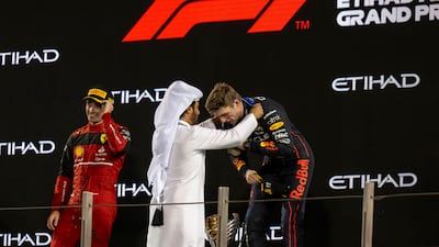Mohammed Ben Sulayem, president of the FIA presents a medal to Max Verstappen, winner of the 2022 Formula 1 Etihad Airways Abu Dhabi Grand Prix, on November 20, 2022. AP Photo
