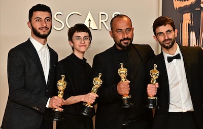 Israeli journalist and filmmaker Yuval Abraham, US producer Rachel Szor, Palestinian filmmaker Hamdan Ballal, Palestinian journalist and filmmaker Basel Adra accept the Best Documentary Feature Film Academy Award. AFP