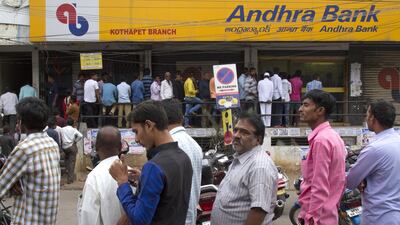 People stand in a queue outside an Andhra Bank branch in Hyderabad, India. Across the country, ATMs ran out of cash. Mahesh Kumar A./AP/REX/Shutterst