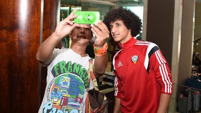 Another fan grabs his chance to have a selfie with Omar Abdulrahman.