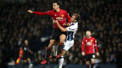 Manchester United's Zlatan Ibrahimovic, left, and West Bromwich Albion's Craig Dawson battle for possession at The Hawthorns, in West Bromwich, England on December 17, 2016. Nick Potts / AP