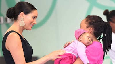 The duchess chats to a mother at M2M. EPA