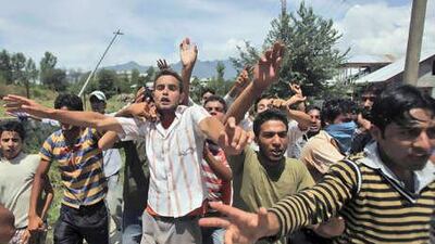 Kashmiri protesters shout slogans during a clash with Indian soldiers on Wednesday in Pampore, south of Srinagar.