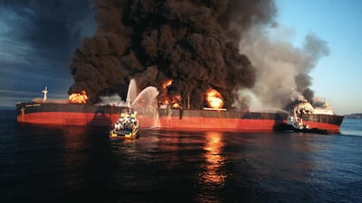 Firefighting vessels on the Singapore-flagged tanker Norman Atlantic after an Iranian attack near the Strait of Hormuz on December 6, 1987. AFP