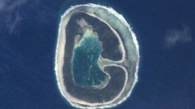 Good day, G. What begins with G? Geostationary satellites in geosynchronous orbits. Greenhouse gases and global warming. Glaciers…going, going, gone. These glorious grains of sand gently groomed by the grinding power of the Pacific Ocean. This image of Pinaki Island was captured by astronauts on the International Space Station in April 2001. Courtesy NASA