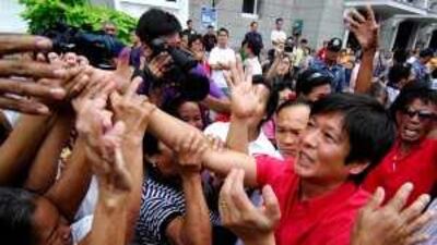 Ferdinand "Bong-Bong" Marcos Jr reaches out to supporters after filing his candidacy papers last month.