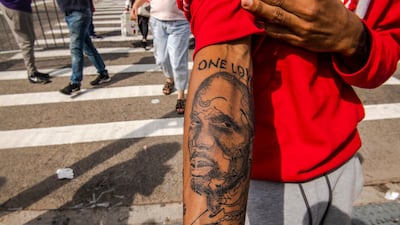 Aaron Baines, 22, shows off his recent tattoo of rapper DMX. AP Photo