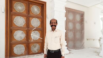 Temple manager N Mohan, pictured in front of ongoing work.