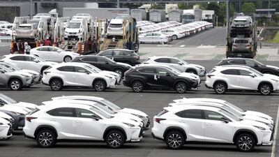 Toyota's new sport utility Lexus NX vehicles are loaded on lorries for delivery to dealers. Kimimasa Mayama / EPA