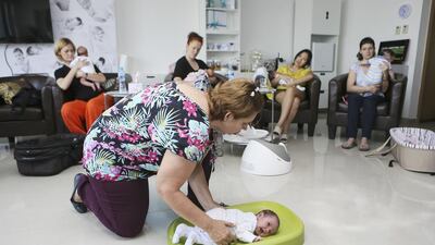 Cecile de Scally, the co-founder of Baby Senses, leads a demonstration at its centre in Jumeirah Lakes Towers. Sarah Dea / The National