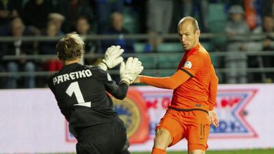 Arjen Robben, winger (Bayern Munich); Age 30; 73 caps. Denied by the outstretched leg of Iker Casillas from handing the Dutch the World Cup four years ago. Has won six league titles in England, Spain and Germany since 2005, and also the Champions League with Bayern Munich in 2013, where he scored the winning goal in the final against Borussia Dortmund. Has extreme pace and a rocket-like shot and scored 22 times for the Netherlands. Liis Treimann / AP