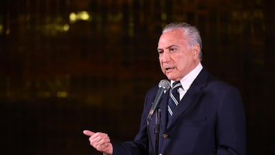 Brazil's outgoing president Michel Temer delivers a speech in Brasilia after official results gave Mr Bolsonaro 55.7 percent of the vote of the presidential run-off election. AFP