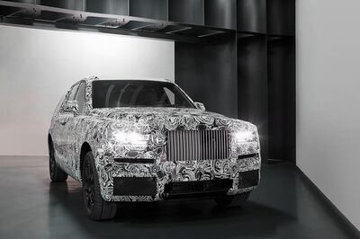 A camouflaged prototype of Rolls-Royce's SUV, currently named the Cullinan. Rolls-Royce