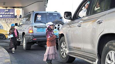 Hamas Hajiri, 8, and her sister Yasmin, 10, sell tissues to passing drivers at the Safia traffic junction in Sanaa’s city centre.