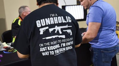 A gun enthusiast attends the a show three days after a mass shooting less than 50km away at the Marjory Douglas High School in Parkland, Florida. AFP/Michele Eve Sandberg