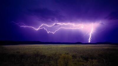 Thunderbolt: not the best weather to get stranded in whole on safari in Tanzania – in an open vehicle. Photo by Alamy