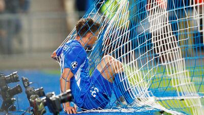 Joakim Maehle falls into the net. Reuters