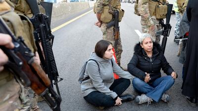 Lebanese anti-government protesters hold hands as they attempt to block the highway during a protest at the Jal El Dib area north of Beirut, Lebanon. EPA