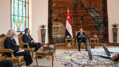 Egypt's President Abdel Fattah El Sisi, right, meets with Mr Blinken, centre, in Cairo. AFP