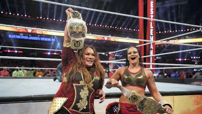 Nia Jax and Shayna Baszler celebrate defending their WWE Women's Tag Team Championship belts. Courtesy WWE