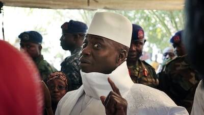 Former Gambian president Yahya Jammeh shows his inked finger before voting in the capital, Banjul, on December 1, 2016, in a presidential election that he lost to Adama Barrow. Jerome Delay / AP Photo
