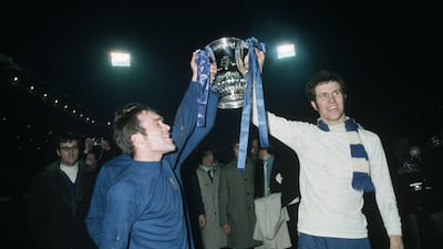 Chelsea's Ron Harris, left, and Peter Osgood lift the FA Cup trophy after beating Leeds United 2-1 in the final replay at Old Trafford on April 29, 1970. Getty