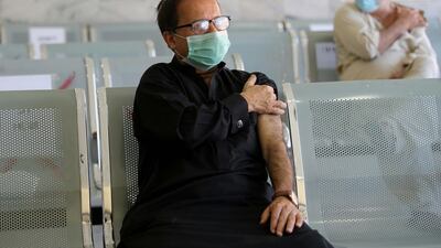Pakistani senior citizens reacts after he receives a dose of the Chinese-made Sinopharm vaccine against Covid-19 during the second phase of Pakistan's coronavirus vaccination drive in Peshawar, Pakistan. The Pakistan government tightened restrictions on 29 March, amid a fresh Covid-19 wave that is turning out to be worse than the previous two in a country battling an inordinate delay in anti-coronavirus vaccines. EPA