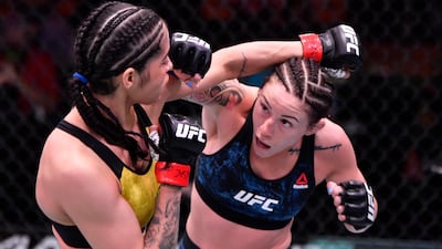 Mallory Martin, right, punches Polyana Viana of Brazil in their strawweight fight during the UFC 258 event at UFC APEX in Las Vegas, Nevada. Jeff Bottari / Zuffa LLC / UFC