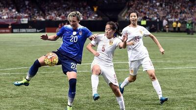 NEW ORLEANS, LA - DECEMBER 16: Abby Wambach #20 of the United States is defended by Wu Haiyan #5 of China during the first half of the women's soccer match at the Mercedes-Benz Superdome on December 16, 2015 in New Orleans, Louisiana. Stacy Revere/Getty Images/AFP== FOR NEWSPAPERS, INTERNET, TELCOS & TELEVISION USE ONLY ==