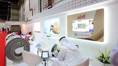 Above, the Al Ittihad stand at the three-day Smart Government Exhibition and Conference at the Dubai World Trade Centre. Satish Kumar / The National