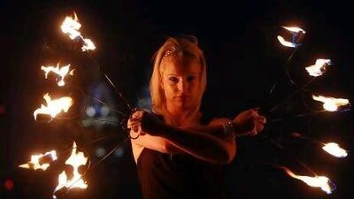 Monique Robinson, the co-founder of Wildfire Dancers, shows off some of her skills. Satish Kumar / The National