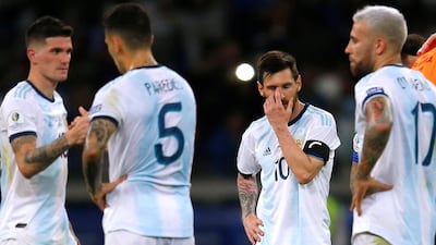 Argentina's Lionel Messi, second right, reacts after the match, a 1-1 draw. Reuters