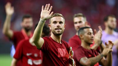 Jordan Henderson celebrates a friendly win over Crystal Palace at the National Stadium in Singapore. Getty
