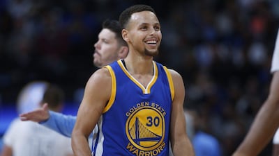 Stephen Curry scored 41 points in Golden State's record-extending win against Phoenix. David Zalubowski / AP Photo