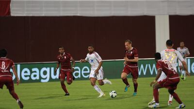 Al Wahda's Srdan Andric dribbles the ball through Al Jazira defenders during the semi-Final Pro League football match between Al Wahda v Al Jazira (white) at Al Wahda's (red) at Al Nahyan Stadium in Abu Dhabi on Monday March 25, 2013. (Ravindranath K / The National)?