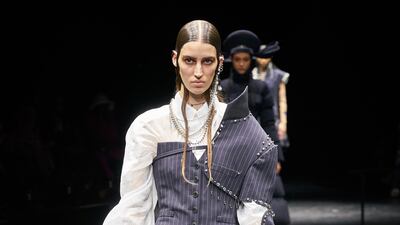 Men's suiting is taken apart and made into a corset at Jean Paul Gaultier.