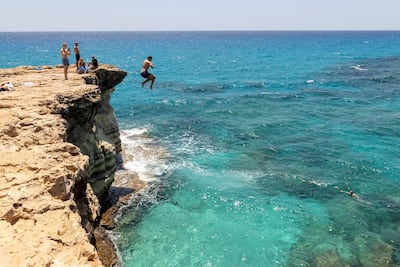 If tourists do holiday on the Mediterranean island, they will have to comply with health protocols which might make cliff jumping tricky. Getty