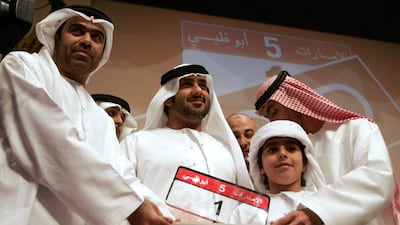 Saeed Al Khouri with the most expensive car number plate – at the time – which he bought in an auction in Abu Dhabi in 2008. Photo: AFP
