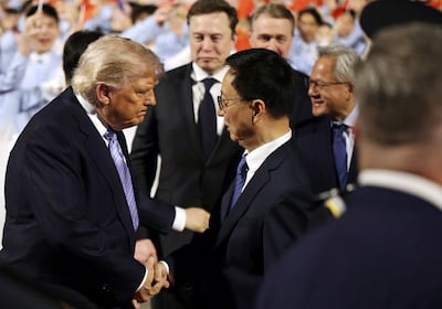President Donald Trump is greeted by Vice President of China Han Zheng. Getty Images