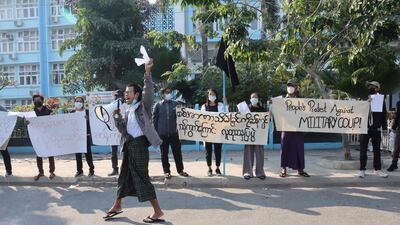 A group of protestors hold a demonstration in Mandalay after a lightning coup brought a country on the path to democracy to a shuddering halt, returning the reins of power to the military who ruled Myanmar with an iron fist for nearly five decades. AFP