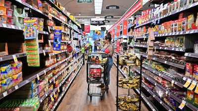 A woman shops for groceries at a supermarket in California. The Federal Reserve is expected to increase interest rates twice more this year to bring inflation close to its target 2 per cent range. AFP
