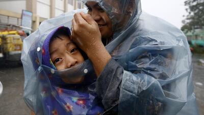 The storm weakened slightly as it cut across the main island of Luzon and exited into the South China Sea on Wednesday afternoon, but forecasters warn it may pick up strength again as it tracks towards southern China. Dennis M Sabangan/EPA